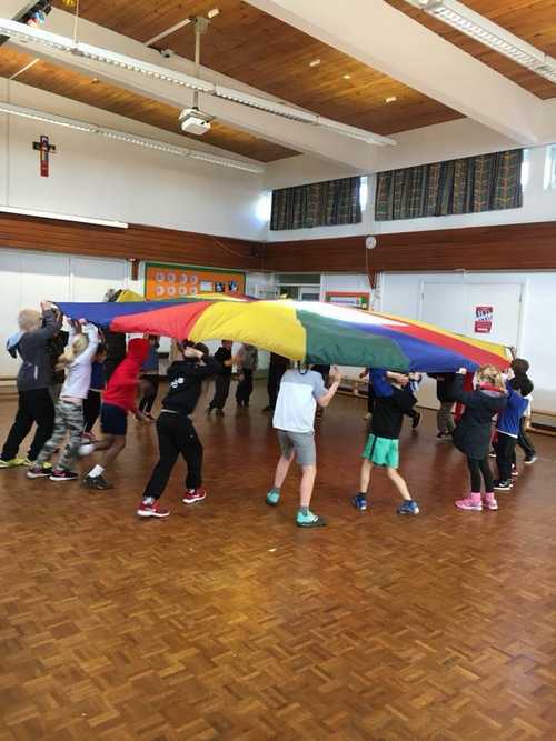 Children enjoying a parachute game